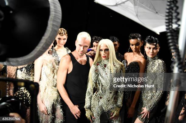 Designer David Blond and Phillipe Blond pose with models backstage for the The Blonds collection during, New York Fashion Week: The Shows at Gallery...