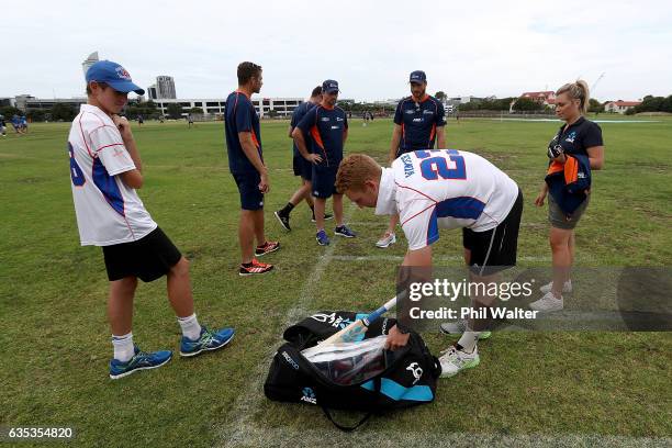 Dan Winter and Jordan Gatler of Rosmini College look over the ultimate family cricket set up as Martin Guptill, Tim Southee, Colin Munro and Mitch...