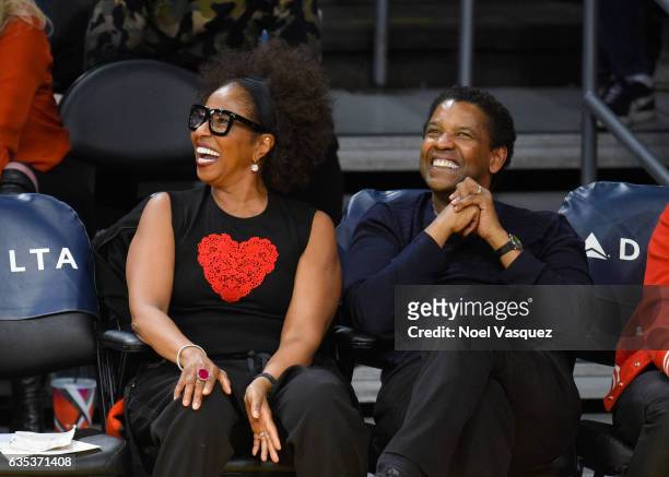 Denzel Washington and Pauletta Washington attend a basketball game between the Sacramento Kings and the Los Angeles Lakers at Staples Center on...