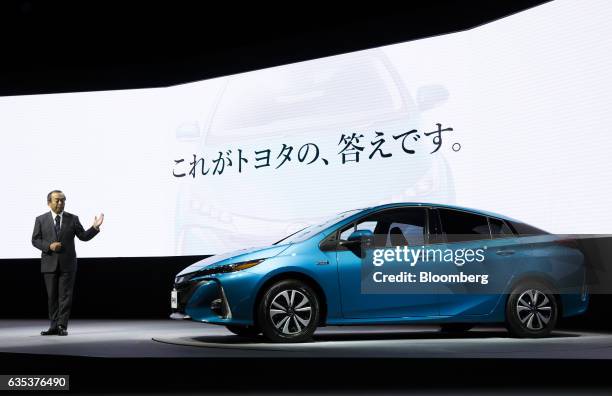 Takeshi Uchiyamada, chairman of Toyota Motor Corp., introduces the company's new Prius plug-in hybrid vehicle , known as Prius Prime in the U.S., at...