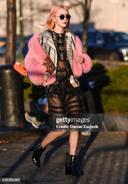 Irene Kim is seen wearing a pink fur coat and Coach sheer dress outside the Coach show during New York Fashion Week: Women's Fall/Winter 2017 on...