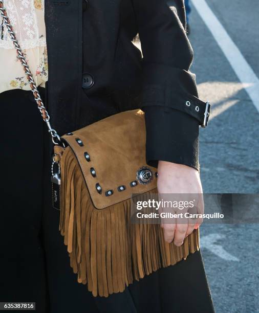 Actress Drew Barrymore, handbag detail, is seen arriving to the Coach FW17 Show at Pier 76 on February 14, 2017 in New York City.