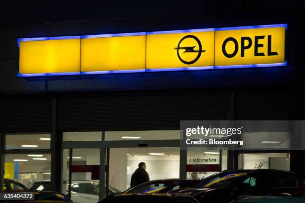 Customer enters an Opel automobile dealership in Berlin, Germany, on Tuesday, Feb. 14, 2017. PSA Group's proposal to buy General Motors Co.'s Opel...