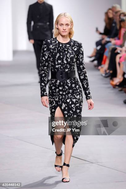 Model Amber Valletta walks the runway during the Michael Kors Collection Fall 2017 fashion show at Spring Studios on February 15, 2017 in New York...