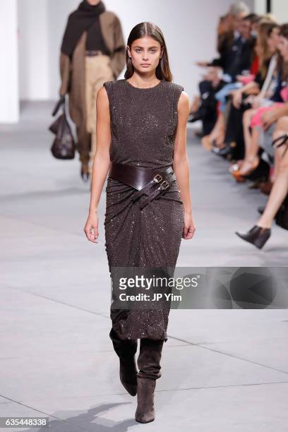 Model Taylor Hill walks the runway during the Michael Kors Collection Fall 2017 fashion show at Spring Studios on February 15, 2017 in New York City.