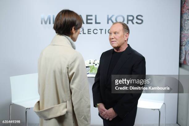 Designer Michael Kors speaks backstage before the Michael Kors Collection Fall 2017 runway show at Spring Studios on February 15, 2017 in New York...