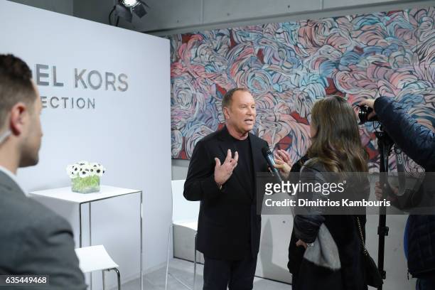 Designer Michael Kors speaks backstage before the Michael Kors Collection Fall 2017 runway show at Spring Studios on February 15, 2017 in New York...