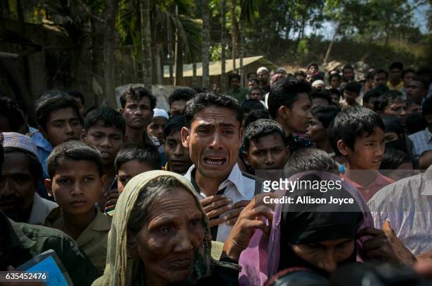 Rohingya refugees gather for aid supplies as the crew of the Nautical Aliya distributes food and hygiene supplies at Kutapalong refugee camp February...