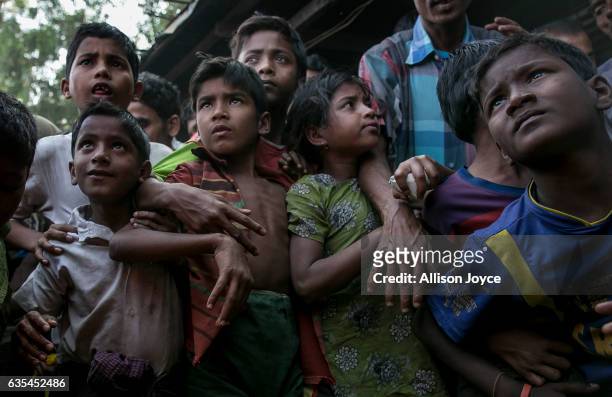 Rohingya refugees gather, hoping to get relief supplies donated by the crew of the Nautical Aliya in the Leda Rohingya refugee camp on February 15,...