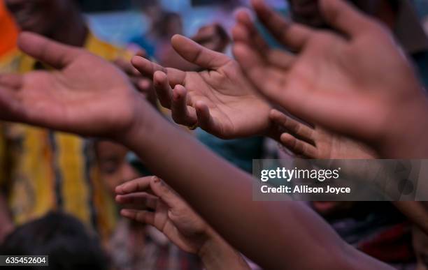 Rohingya refugees gather for aid supplies as the crew of the Nautical Aliya distributes food and hygiene supplies at Kutapalong refugee camp February...