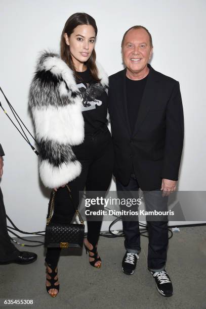 Model Ashley Graham and designer Michael Kors pose backstage before the Michael Kors Collection Fall 2017 runway show at Spring Studios on February...