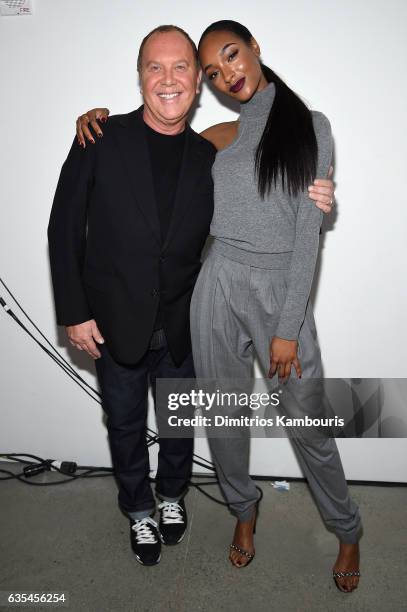 Designer Michael Kors and model Jourdan Dunn pose backstage at the Michael Kors Collection Fall 2017 runway show at Spring Studios on February 15,...