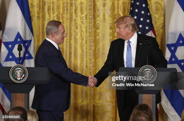 President Donald Trump and Israel Prime Minister Benjamin Netanyahu shake hands during a joint news conference at the East Room of the White House...