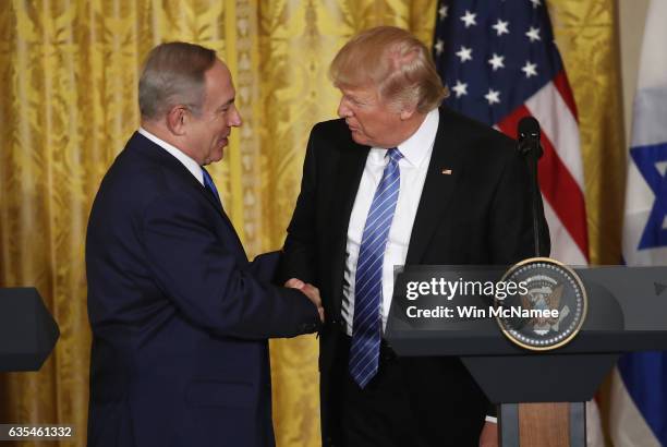 President Donald Trump and Israel Prime Minister Benjamin Netanyahu shake hands during a joint news conference at the East Room of the White House...