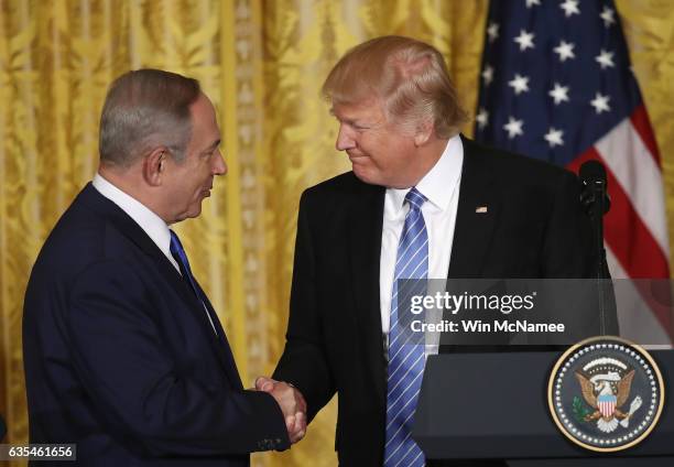 President Donald Trump and Israel Prime Minister Benjamin Netanyahu shake hands during a joint news conference at the East Room of the White House...