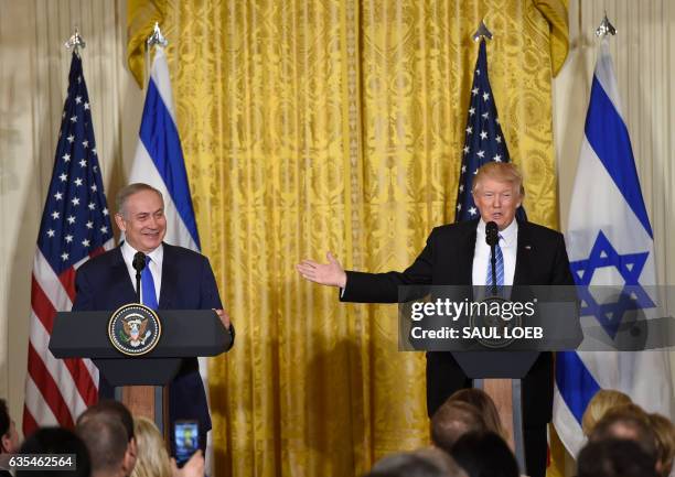 President Donald Trump and Israeli Prime Minister Benjamin Netanyahu hold a joint press conference in the East Room of the White House in Washington,...