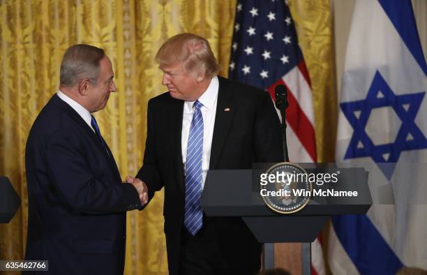 President Donald Trump and Israel Prime Minister Benjamin Netanyahu shake hands during a joint news conference at the East Room of the White House...