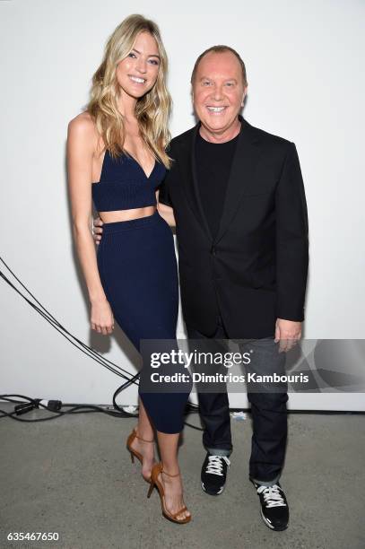 Model Martha Hunt and designer Michael Kors pose backstage before the Michael Kors Collection Fall 2017 runway show at Spring Studios on February 15,...