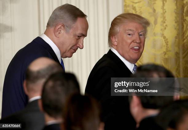 President Donald Trump reacts to a reporter shouting a question as he departs with Israel Prime Minister Benjamin Netanyahu following a joint news...