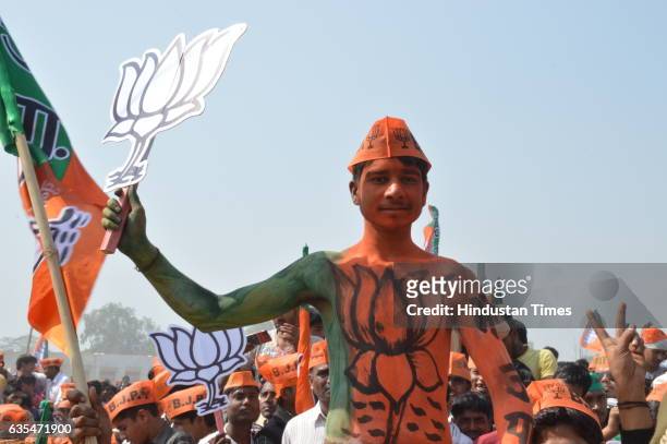 Supporters listening to Prime Minister Narendra Modi during an election campaign rally at the military ground, Gursahaiganj on February 15, 2017 in...