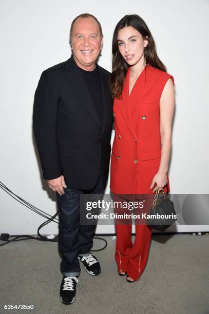 Designer Michael Kors and actress Rainey Qualley pose backstage before the Michael Kors Collection Fall 2017 runway show at Spring Studios on...