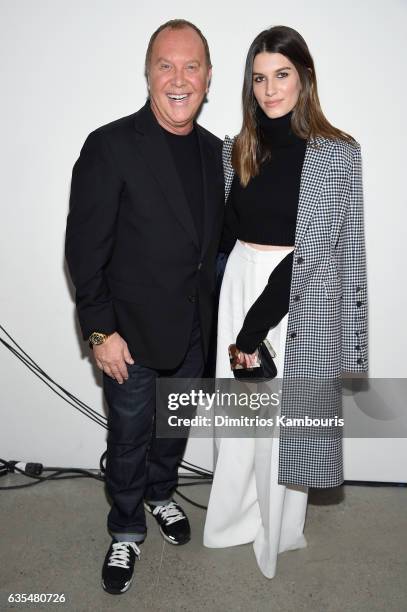 Michael Kors and Rose Gilroy attend the Michael Kors Collection Fall 2017 runway show at Spring Studios on February 15, 2017 in New York City.