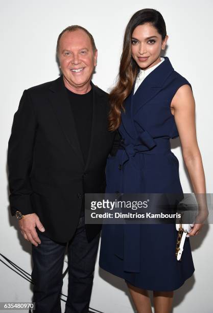 Michael Kors and Deepika Padukone pose backstage before the Michael Kors Collection Fall 2017 runway show at Spring Studios on February 15, 2017 in...