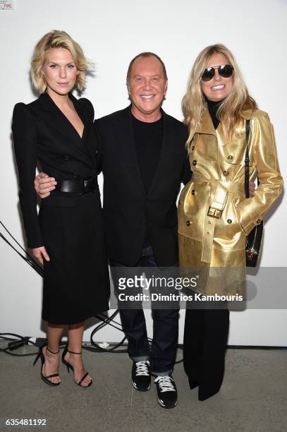Alexandra Richards, Michael Kors, and Patti Hansen pose backstage before the Michael Kors Collection Fall 2017 runway show at Spring Studios on...