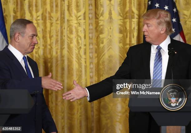 President Donald Trump and Israel Prime Minister Benjamin Netanyahu shake hands following a joint news conference at the East Room of the White House...