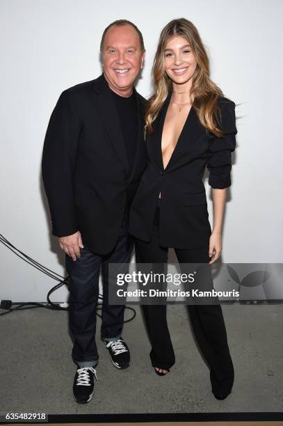 Michael Kors and Camila Morrone pose backstage before the Michael Kors Collection Fall 2017 runway show at Spring Studios on February 15, 2017 in New...