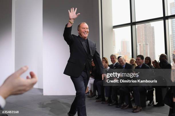 Designer Michael Kors walks the runway during the Michael Kors Collection Fall 2017 runway show at Spring Studios on February 15, 2017 in New York...