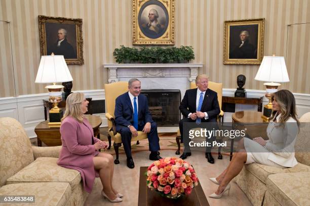 President Donald Trump, Israel Prime Minister Benjamin Netanyahu, his wife Sara Netanyahu and U.S. First lady Melania Trump sit in the Oval Office of...