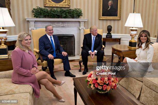 President Donald Trump, Israel Prime Minister Benjamin Netanyahu, his wife Sara Netanyahu and U.S. First lady Melania Trump sit in the Oval Office of...