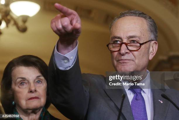 Senate Minority Leader Chuck Schumer points to a reporter as Sen. Dianne Feinstein , ranking member of the Senate Judiciary Committee, looks on at a...