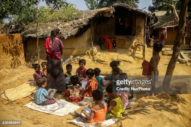 Ethnic of minority Rohingya children are seen playing in front of their makeshift refugees camp in Kutupalong , Bangladesh on February 15, 2017....