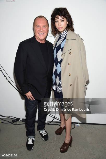 Michael Kors and actress Hikari Mori attend the Michael Kors Collection Fall 2017 runway show at Spring Studios on February 15, 2017 in New York City.