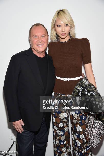 Designer Michael Kors and Soo Joo Park pose backstage before the Michael Kors Collection Fall 2017 runway show at Spring Studios on February 15, 2017...
