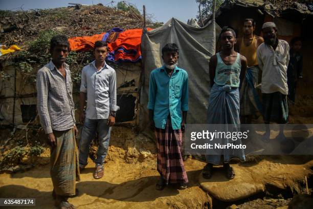 Ethnic of minority of Rohingya community stand outside their makeshift refugess camp in Kutupalong , Bangladesh on February 15, 2017. Almost 60,000...