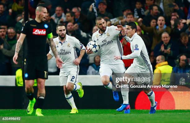 Karim Benzema of Real Madrid celebrates with James Rodriguez and Daniel Carvajal as he scores their first goal during the UEFA Champions League Round...