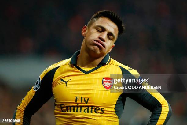 Arsenal's Chilean striker Alexis Sanchez reacts during the UEFA Champions League round of sixteen football match between FC Bayern Munich and Arsenal...