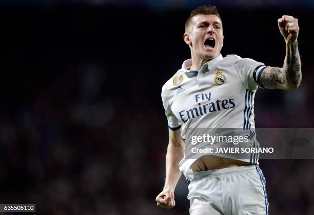 Real Madrid's German midfielder Toni Kroos celebrates a goal during the UEFA Champions League round of 16 first leg football match Real Madrid CF vs...