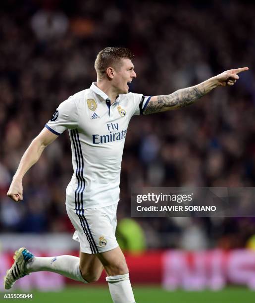 Real Madrid's German midfielder Toni Kroos celebrates a goal during the UEFA Champions League round of 16 first leg football match Real Madrid CF vs...