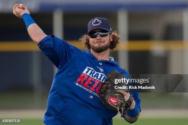 Newly acquired catcher Jarrod Saltalmacchia tosses the ball with Russell Martin. Toronto Blue Jays first day of formal workouts at Bobby Mattick...