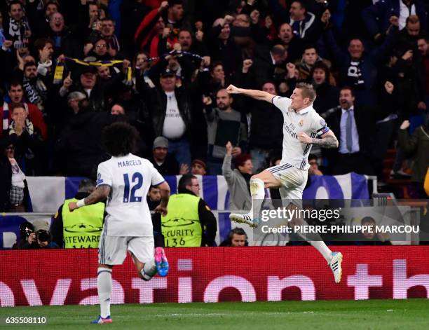 Real Madrid's German midfielder Toni Kroos celebrates a goal during the UEFA Champions League round of 16 first leg football match Real Madrid CF vs...