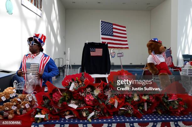 Vendor sells patriotic merchandise during a naturalization ceremony held by U.S. Citizenship and Immigration Services at the Los Angeles Convention...