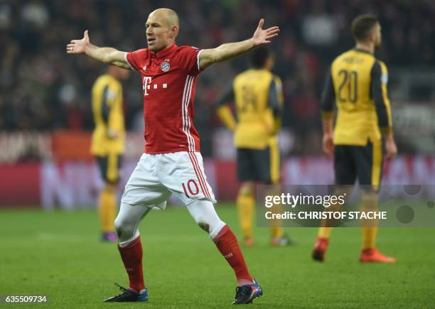 Bayern Munich's Dutch midfielder Arjen Robben celebrates after the first goal during the UEFA Champions League round of sixteen football match...