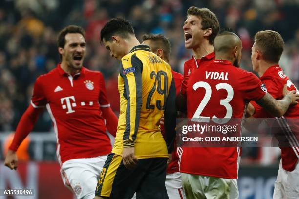 Bayern Munich's forward Thomas Mueller celebrate scoring the 5-1 goal during the UEFA Champions League round of sixteen football match between FC...