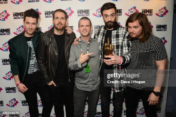 Dan Smith, Will Farquarson, Kyle Simmons and Chris Wood of Bastille pose in the winners room at the VO5 NME Awards 2017 at The O2 Academy Brixton on...