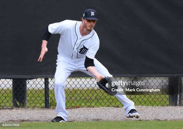 Mark Lowe of the Detroit Tigers catches a baseball in the rag ball drill during Spring Training workouts at the TigerTown complex on February 14,...