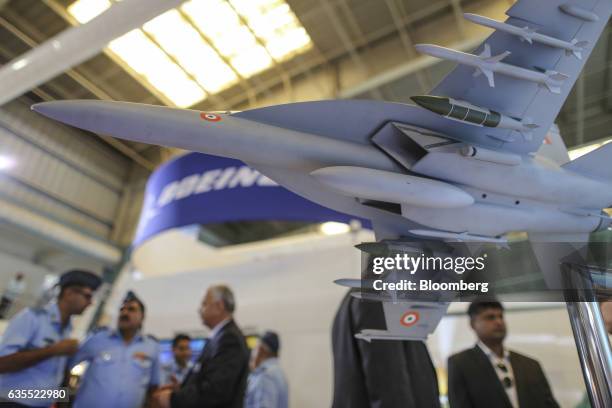 Model of the Boeing Co. F/A-18F Super Hornet aircraft sits on display at company's booth during the Aero India air show at Air Force Station...